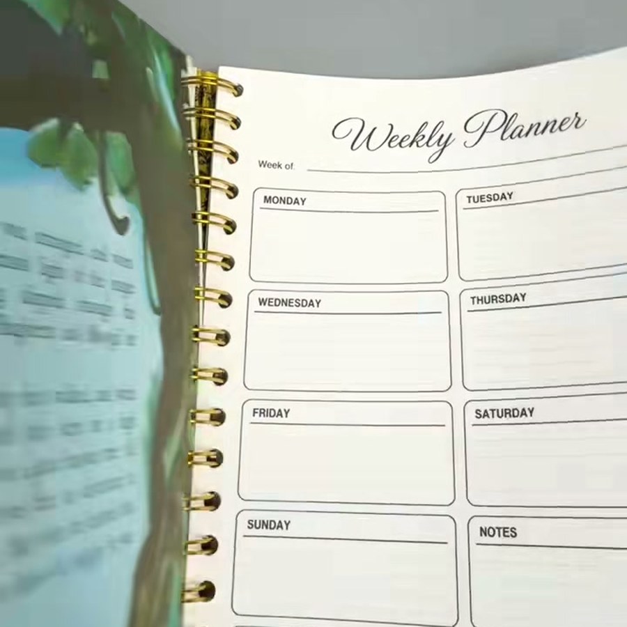Finished handmade weekly planner journal with gold wire binding